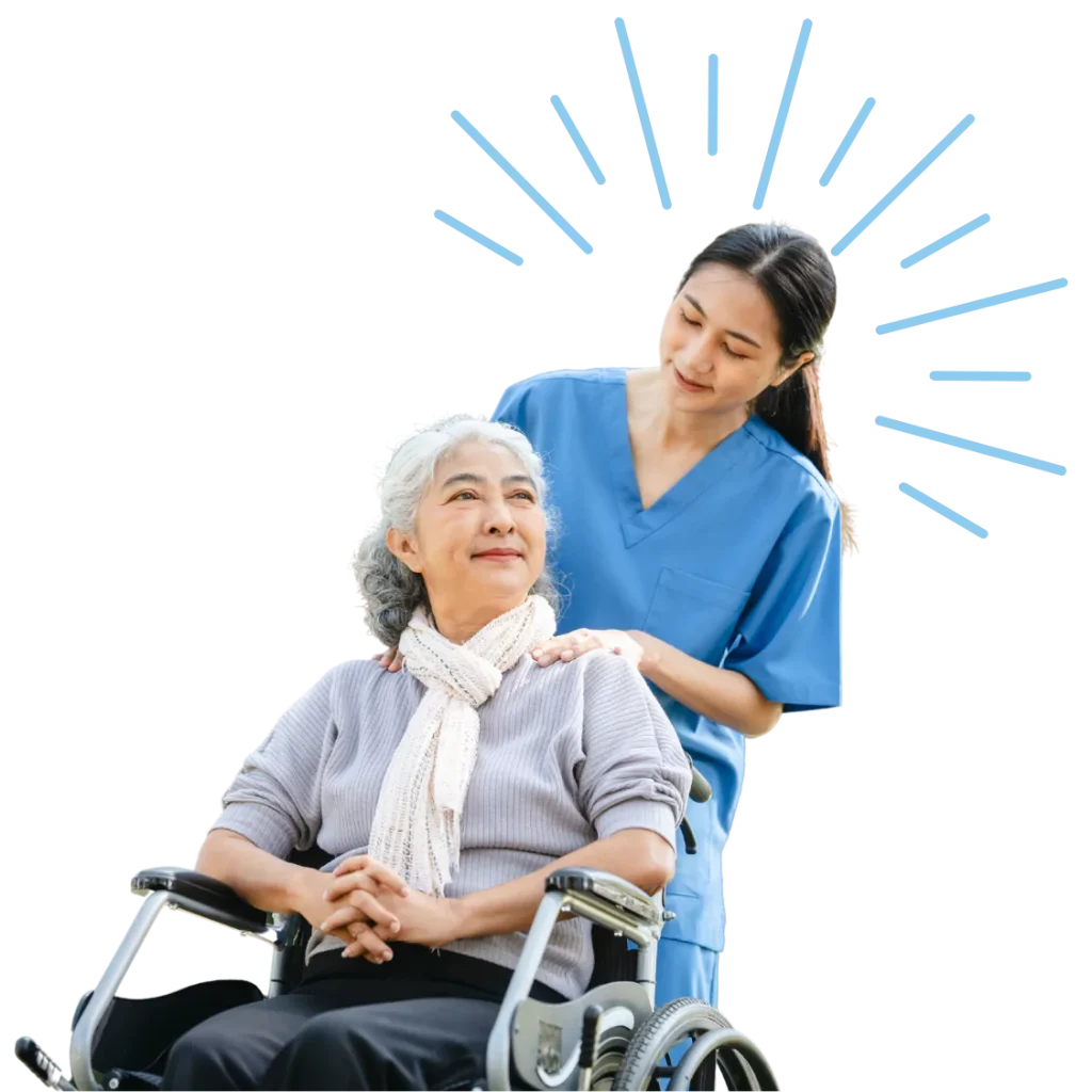 Elderly woman in wheelchair smiling with nurse